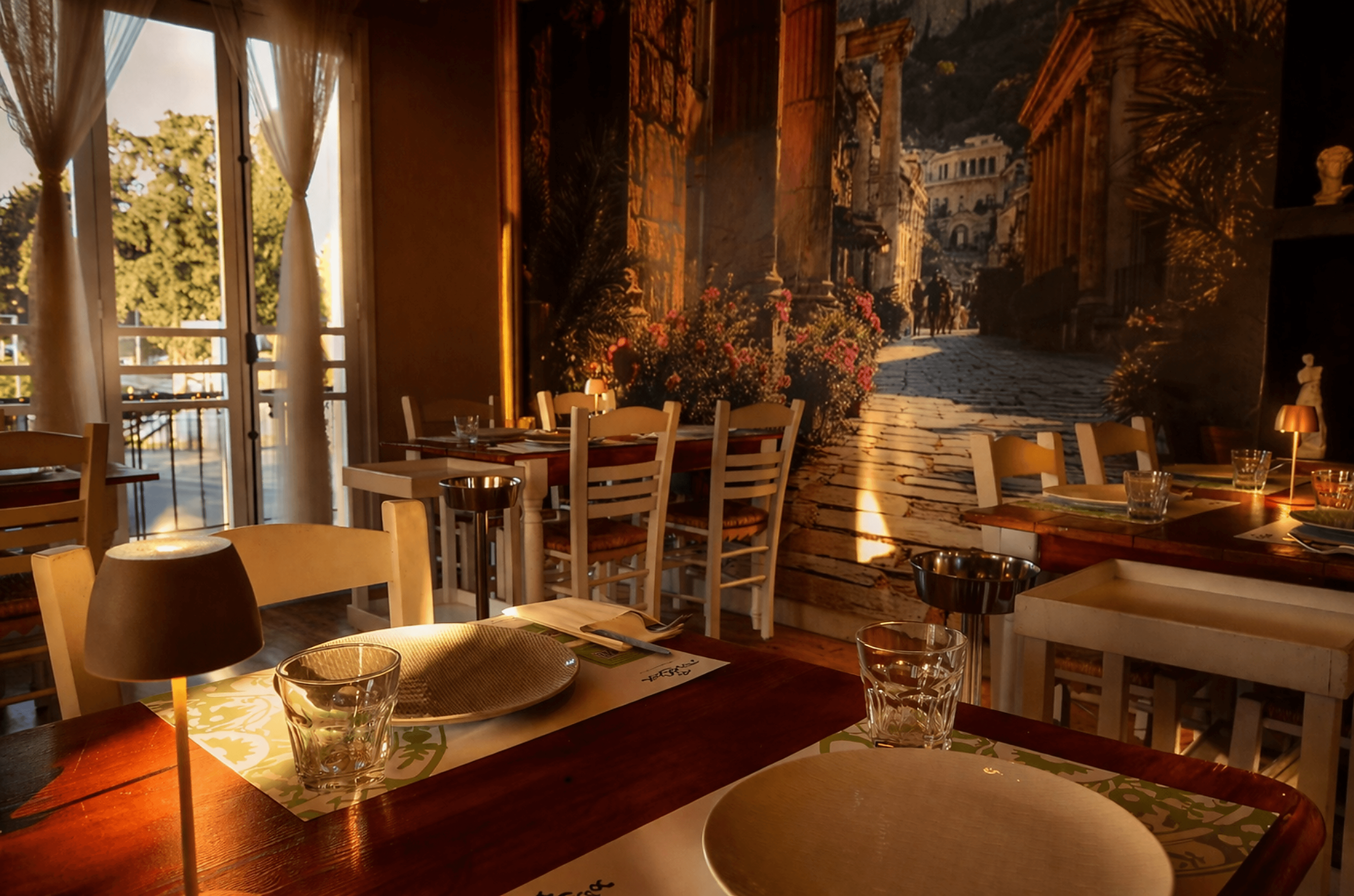 Ta Pinakia restaurant — golden hour interior with warm sunset light