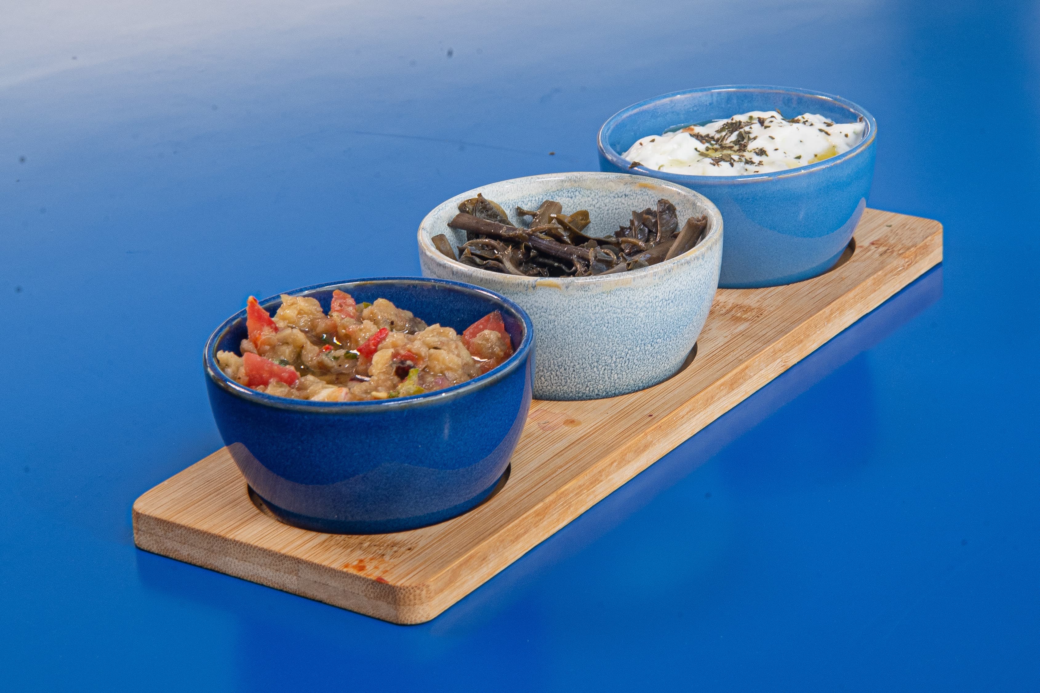 Homemade dips on a wooden board