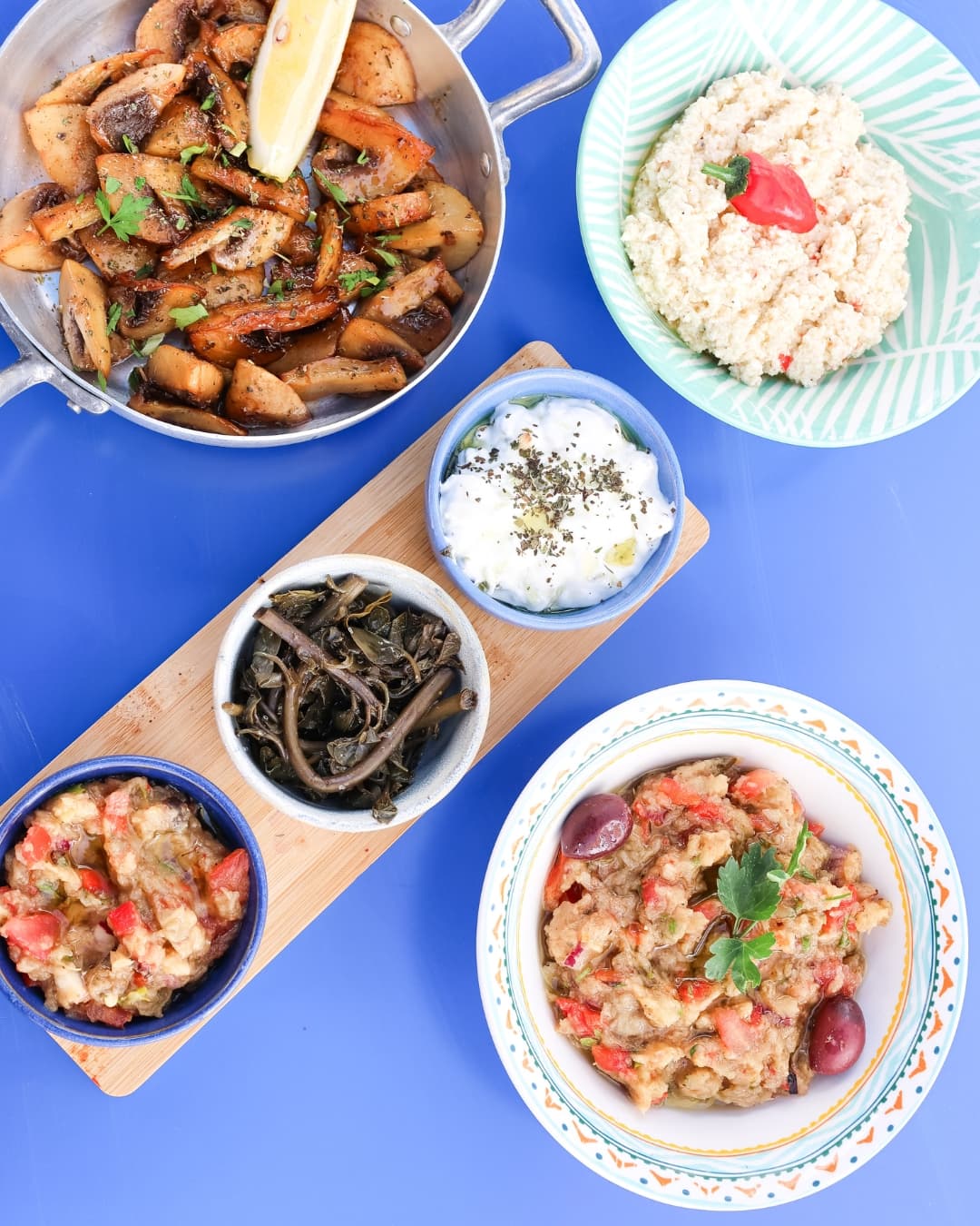 Seasonal dishes and dips on the blue table